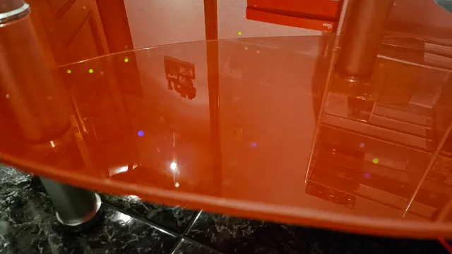 Mesa centro cristal ovalada negra,roja transparent