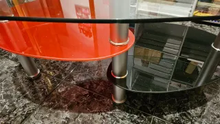 Mesa centro cristal ovalada negra,roja transparent