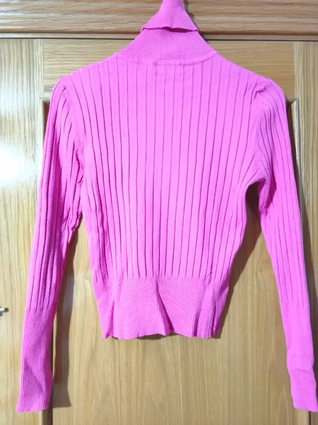 Jersey de cuello alto rosa de canalé