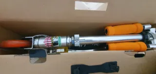 Patinete infantil naranja y plateado