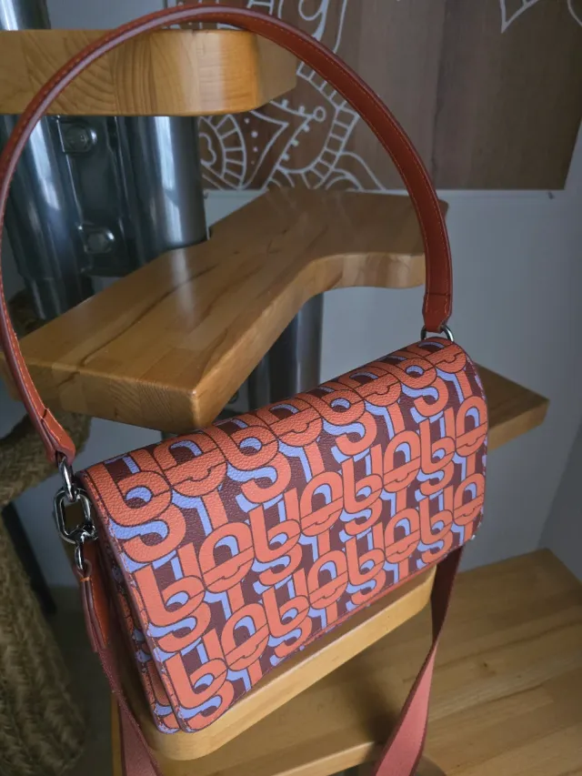 Bolso Tous estampado naranja y morado