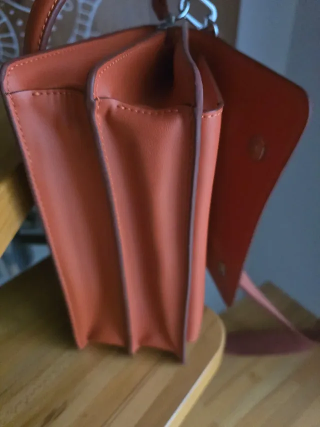 Bolso Tous estampado naranja y morado