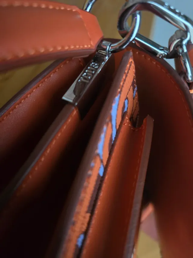 Bolso Tous estampado naranja y morado