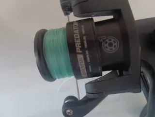 Caña de pescar con carrete y funda