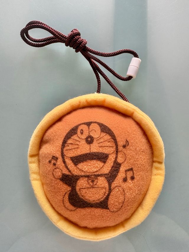 Monedero cartel Doraemon gato cosmico dorayaki