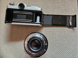 Cámara Nikkormat Plata y Teleobjetivo