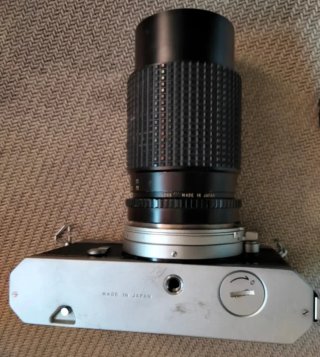 Cámara Nikkormat Plata y Teleobjetivo