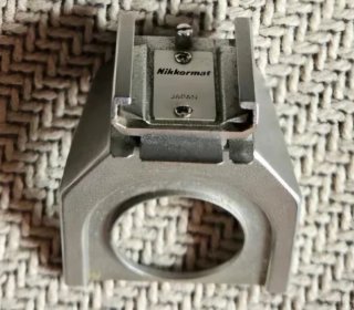 Cámara Nikkormat Plata y Teleobjetivo