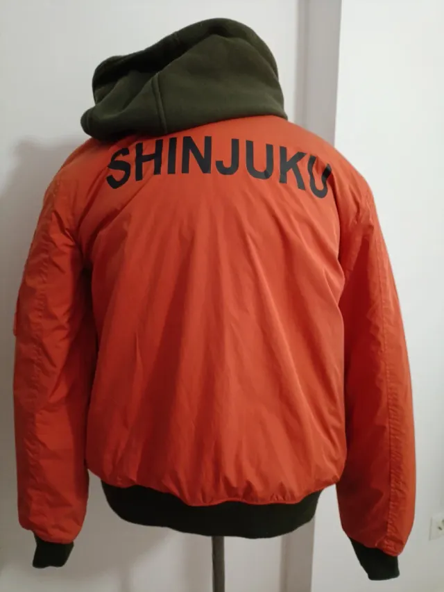 Chaqueta niño bomber naranja y verde con capucha