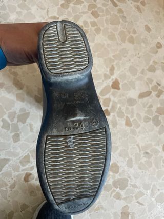 Botas y casco de equitación negros