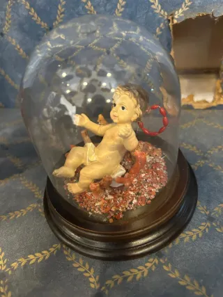 Bambino in teca con base in legno