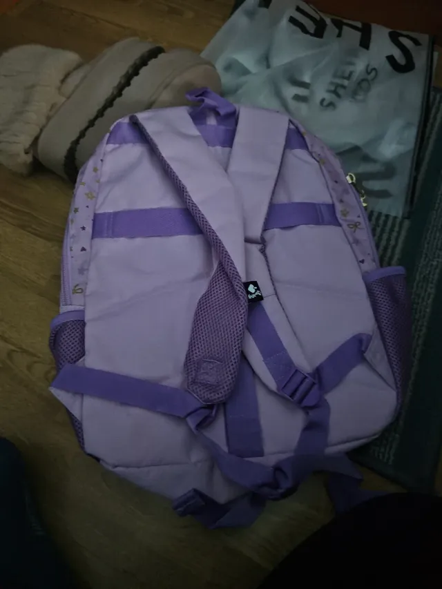 Mochila infantil morada con estrellas nueva