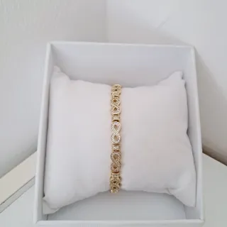 Pulsera infinita dorada con circonitas