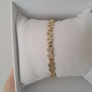 Pulsera infinita dorada con circonitas