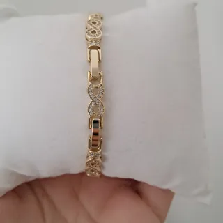 Pulsera infinita dorada con circonitas