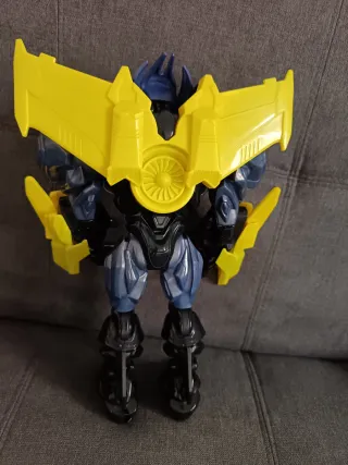 Muñeco de juguete robot azul y amarillo