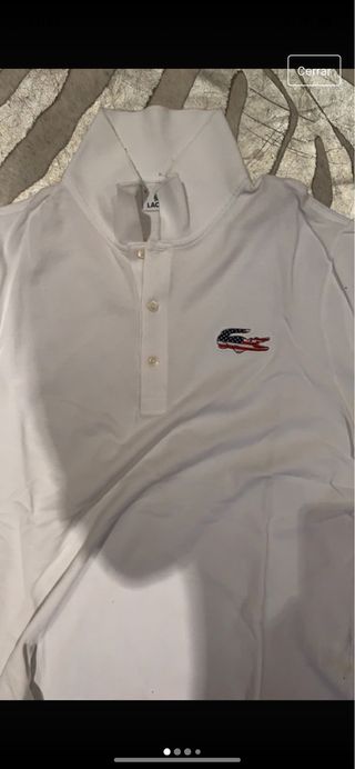 Polo Lacoste blanco con logo bandera USA