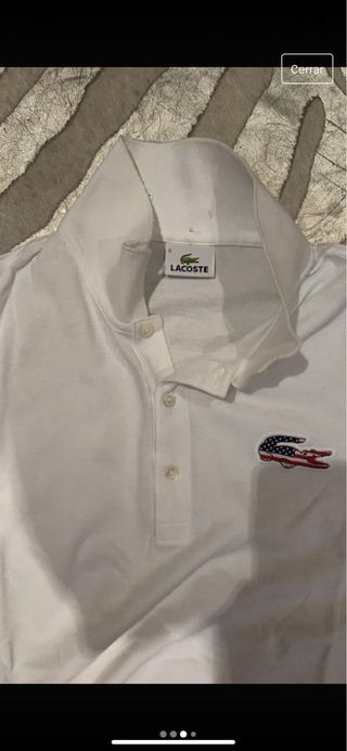 Polo Lacoste blanco con logo bandera USA