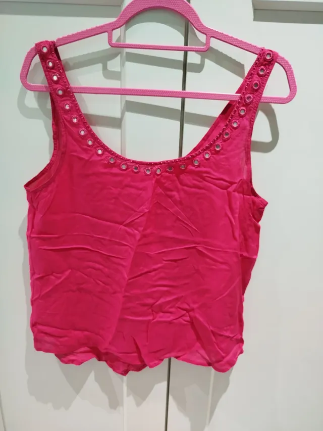Blusa rosa con detalles espejo