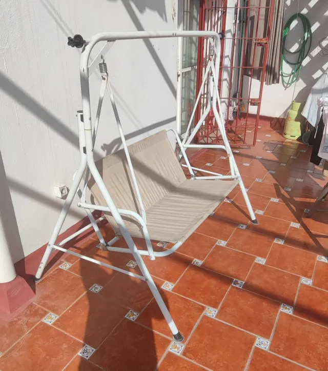 Columpio de jardín y terraza