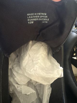 Zapatillas Michael Kors negras con estrellas dorad