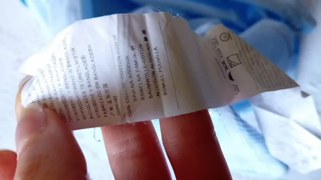 Camicetta sfiancata azzurra a righe verticali