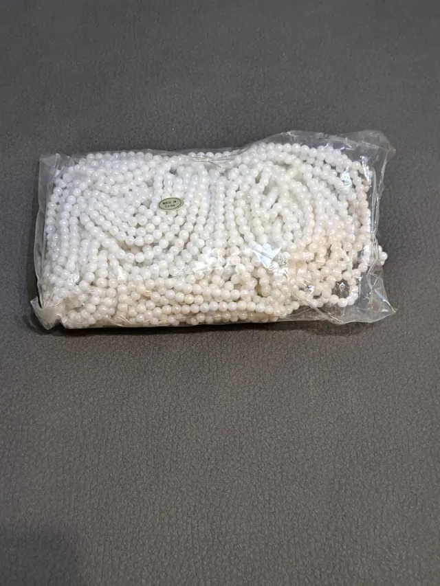 Bolsa de bolitas blancas para manualidades