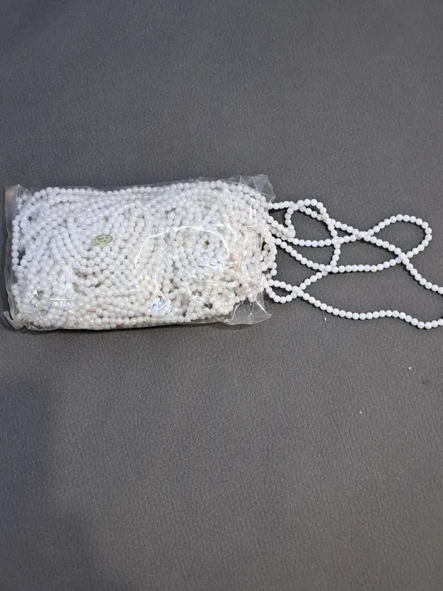 Bolsa de bolitas blancas para manualidades