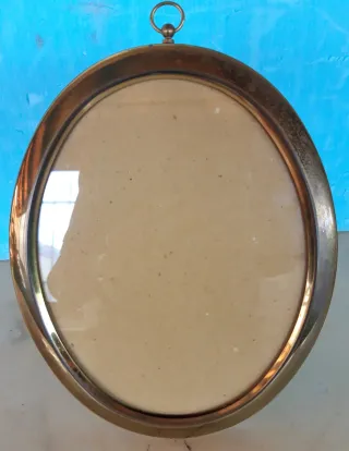 Cornice ovale classica in metallo dorato