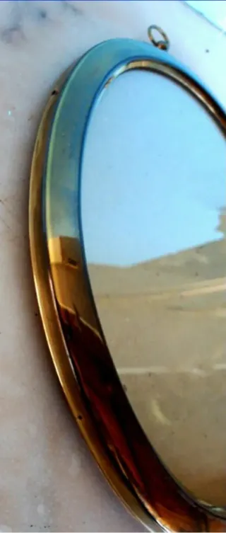 Cornice ovale classica in metallo dorato