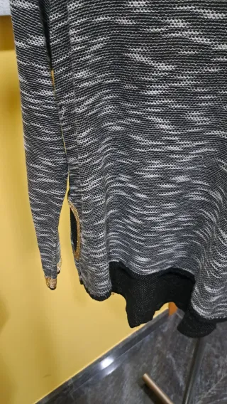 Jersey negro y dorado talla única