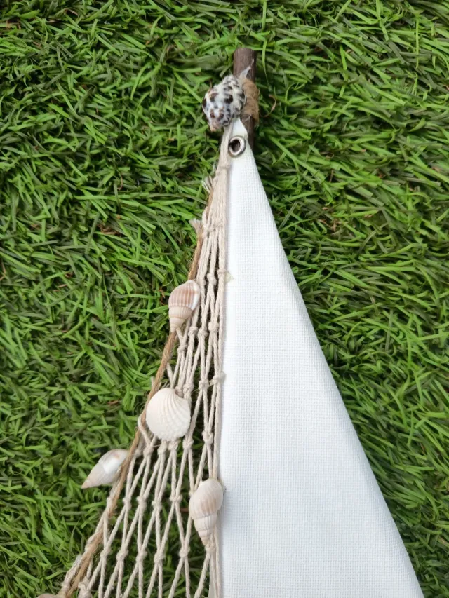 Barco decorativo náutico con conchas