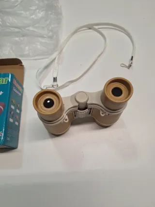 Prismáticos compactos con correa