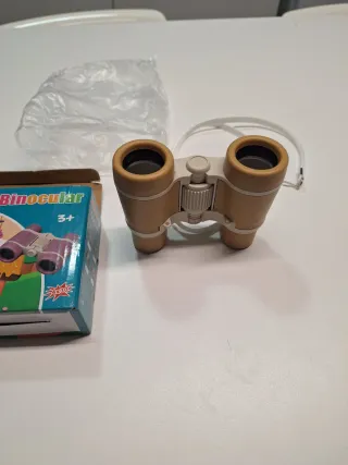 Prismáticos compactos con correa