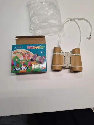 Prismáticos compactos con correa