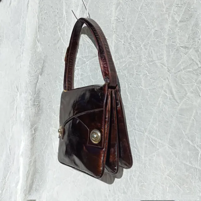 Borsa antica in pelle verniciata color ruggine