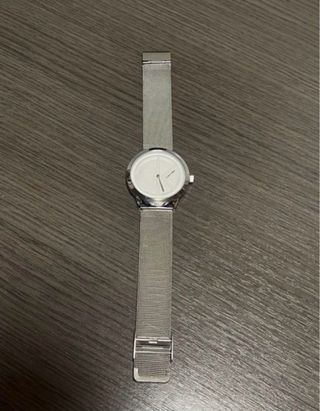Reloj Calvin Klein plateado y blanco