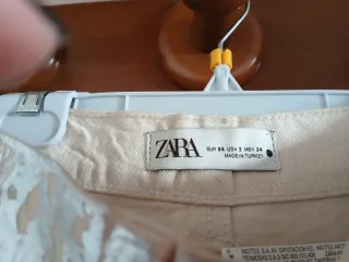 Pantalón plateado brillante