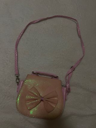 Bolso rosa con lazo brillante