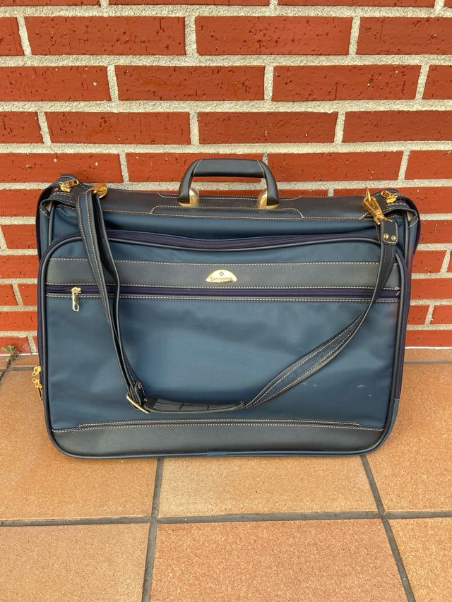 Maletín porta trajes Samsonite azul y dorado