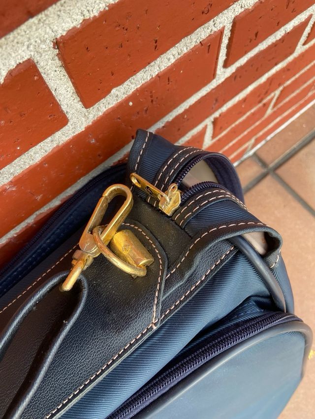 Maletín porta trajes Samsonite azul y dorado