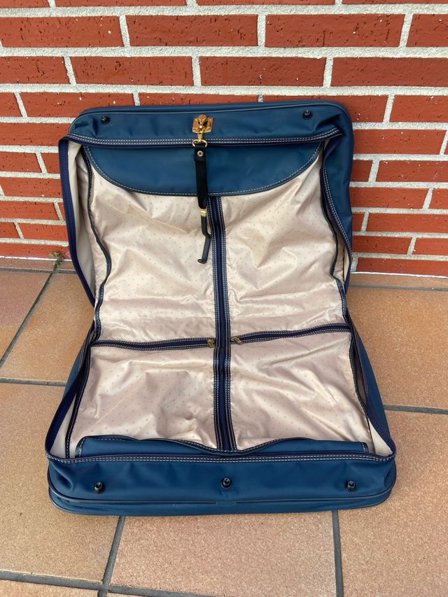 Maletín porta trajes Samsonite azul y dorado