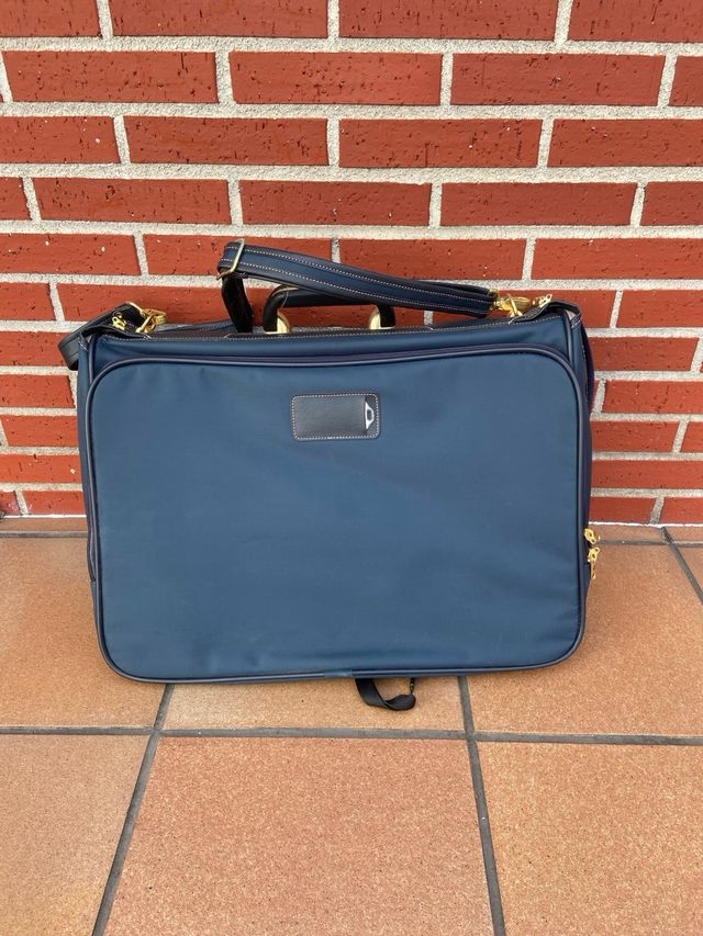 Maletín porta trajes Samsonite azul y dorado