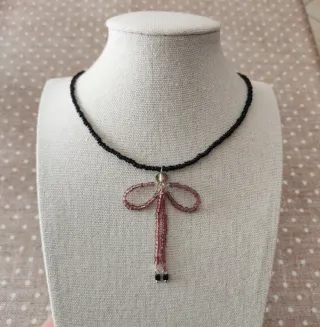 Collana perline fiocco pendente