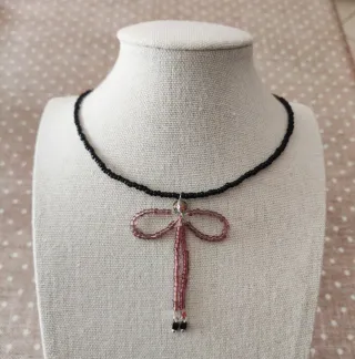 Collana perline fiocco pendente