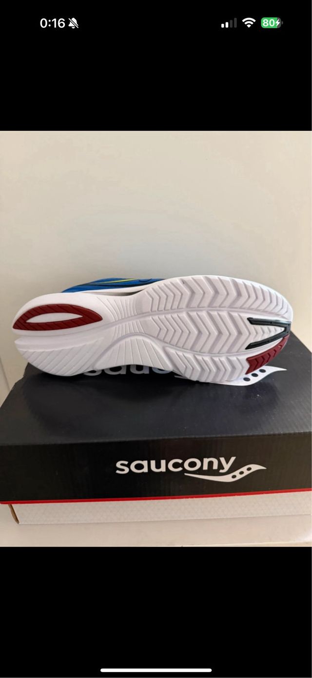 Zapatillas running Saucony azules y amarillas