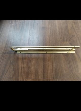 Barra appendiabiti estensibile in metallo dorato