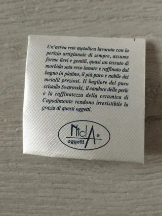 Piccolo portafoto metallico lavorato nuovo