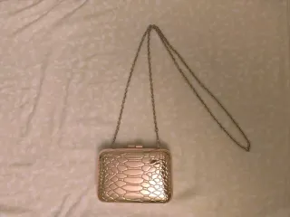 Bolso de fiesta rígido dorado