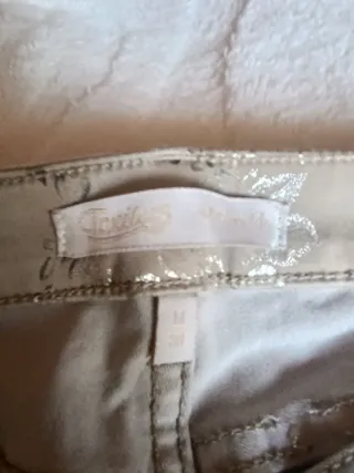 Pantalones mujer beige y plateados